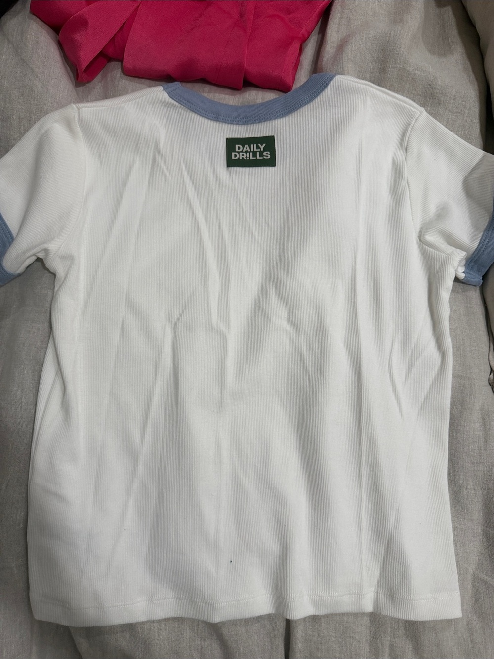 Daily Drills White Boy Tee with Light Blue Trim and Green Logo